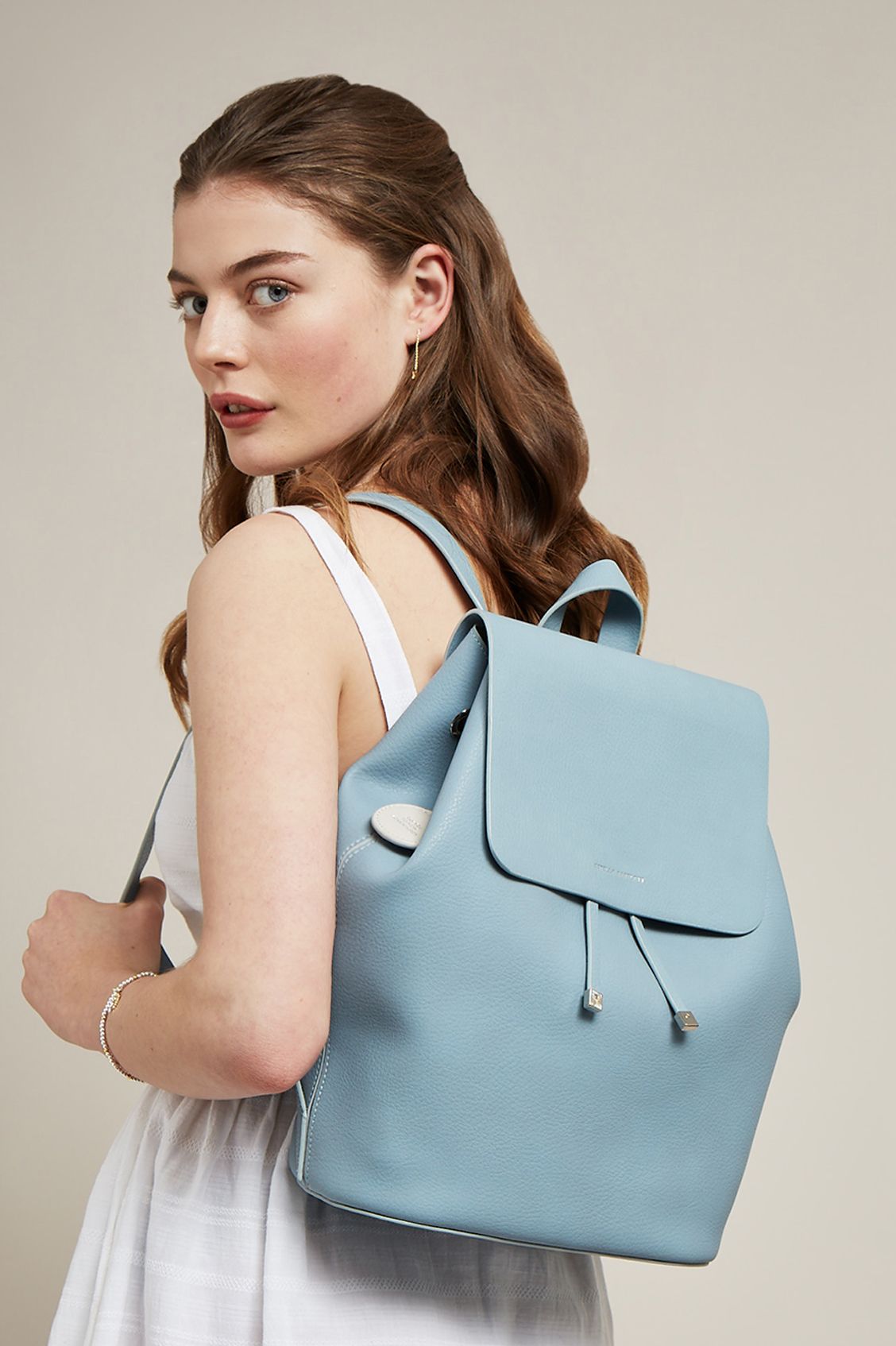 ESTELLA BARTLETT COPPERFIELD DRAWSTRING BACKPACK WITH STONE BAGTAG AND DINO CHARM EBP3516 SKY BLUE