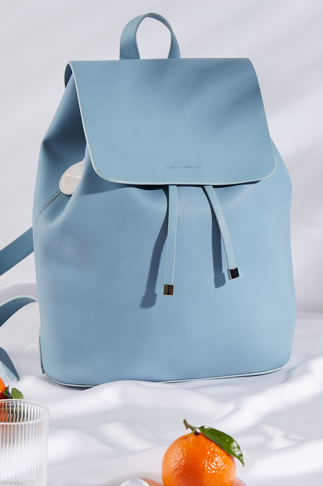 ESTELLA BARTLETT COPPERFIELD DRAWSTRING BACKPACK WITH STONE BAGTAG AND DINO CHARM EBP3516 SKY BLUE