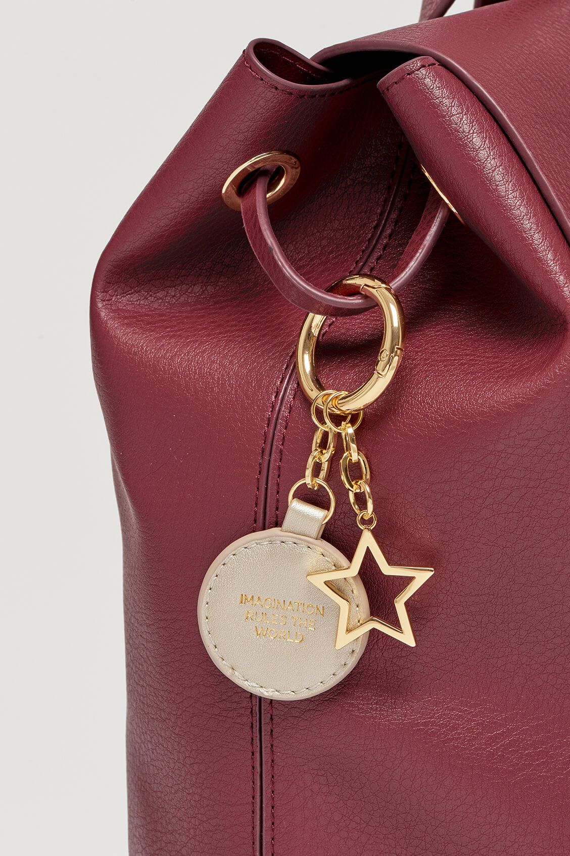 ESTELLA BARTLETT COPPERFIELD DRAWSTRING BACKPACK WITH BAGTAG AND STAR CHARM EBP3606 PLUM